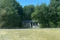 Grasveld voor de woning