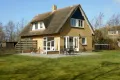 Vakantiehuis met rieten dak